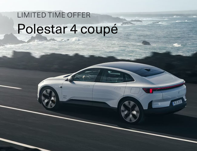 A Polestar 4 driving along a oceanside road