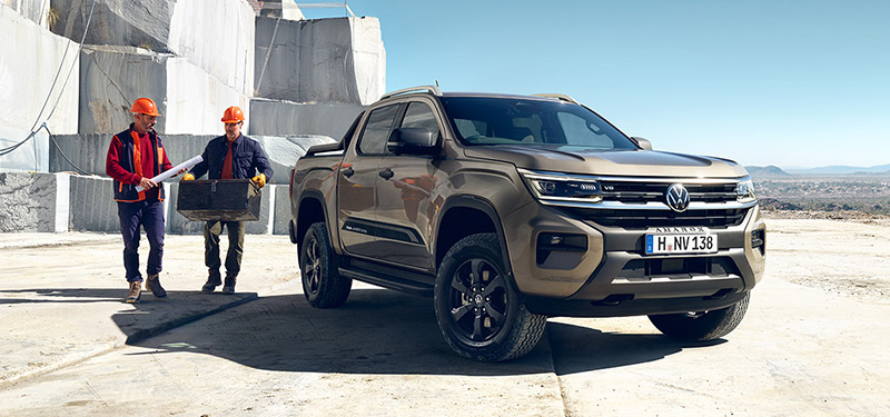 2 Construciton works by a sand coloured Amarok ute at a quary