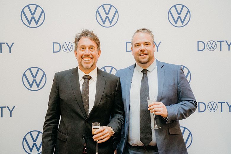 Myles & Micheal infront of the VW brand wall