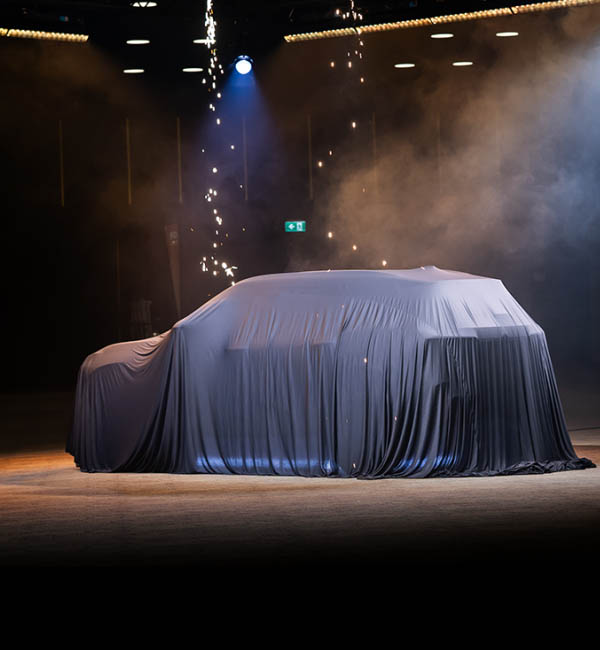 A van under a veil ready to be showcased
