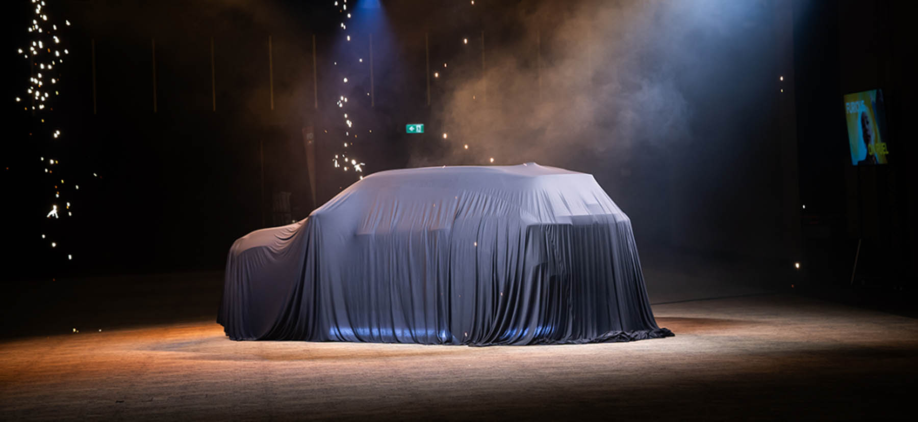 A van under a veil ready to be showcased